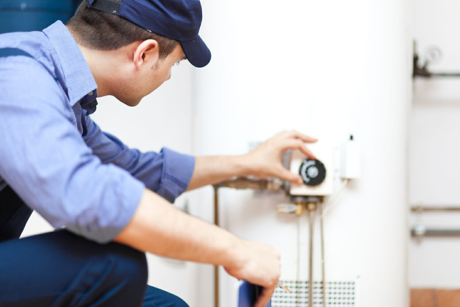 A skilled plumbing technician, ready to provide professional water heater maintenance services to extend the life and energy efficiency of your unit