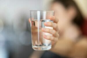 A refreshing glass of water, representing the discussion of alkaline water benefits and risks for health and well-being