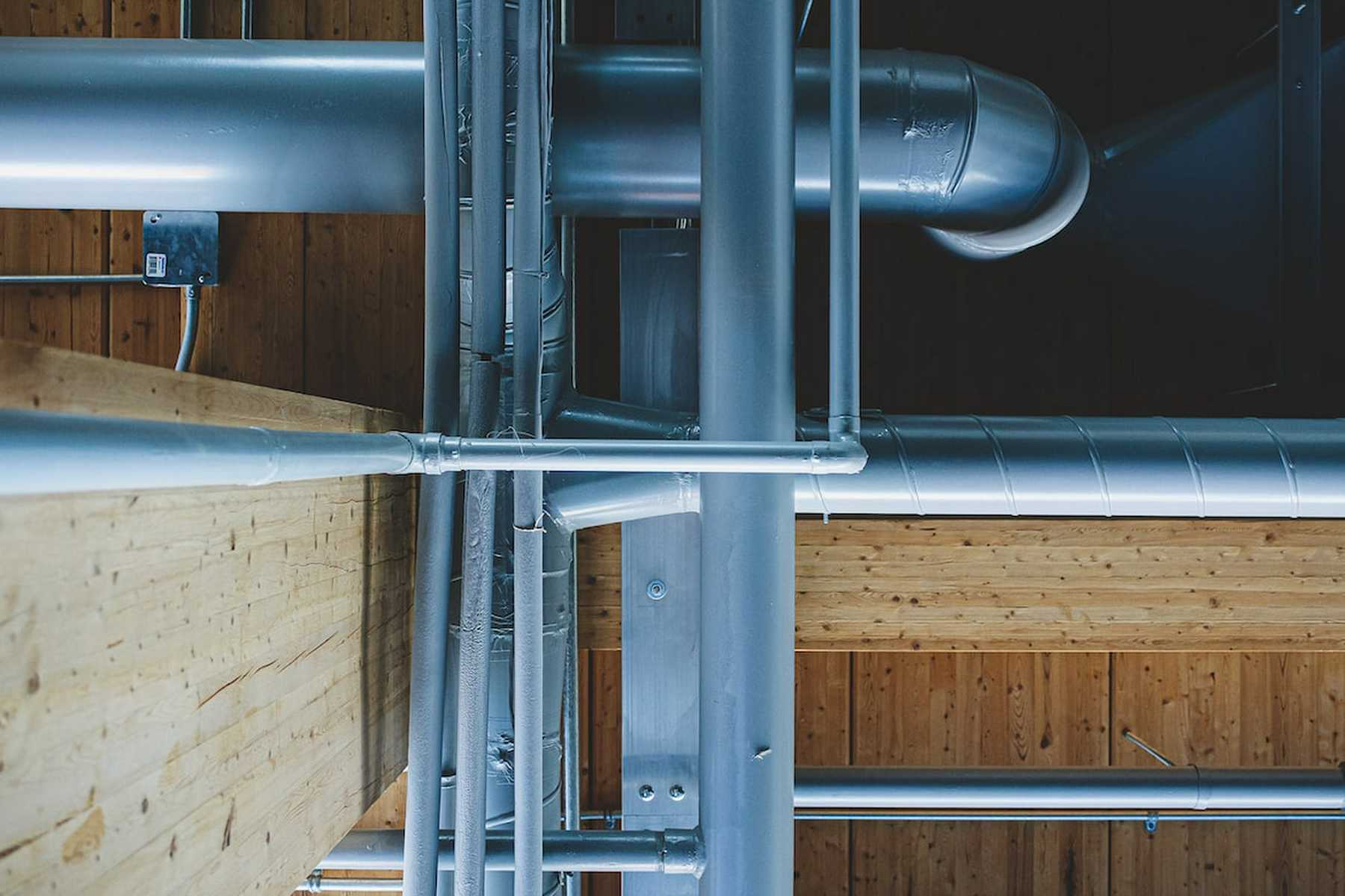 An arrangement of various pipes, illustrating the complexity of a home's plumbing system and potential issues that may arise, such as burst pipes